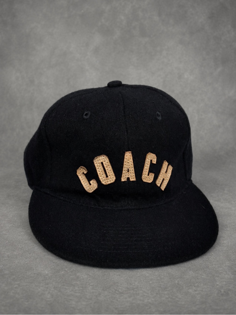 Undefeated wool Baseball Cap with Tan leather Lettering and strap, dark Navy